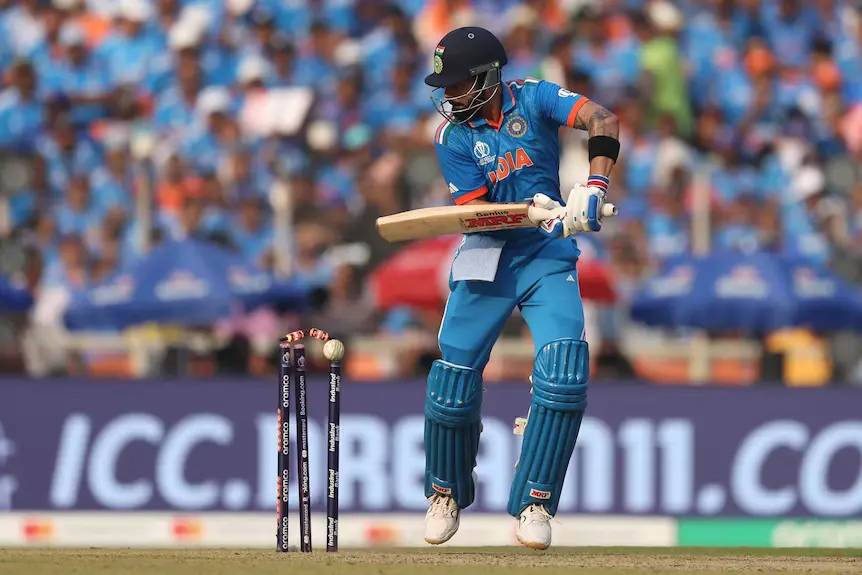 Pat-Cummins-dismisses-Virat-Kohli-as-he-chops-the-ball-onto-his-stumps